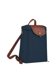 A timeless and durable nod to French style, Longchamp's nylon backpack stows everyday essentials for a tres-chic hands-free commute. Longchamp Le Pliage Medium, Navy Backpack, Medium Backpack, Navy Gold, Tres Chic, Longchamp Le Pliage, Handbag Backpack, Everyday Essentials Products, Backpacks