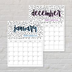 two calendars with the words december and january written in black ink, against a white brick wall