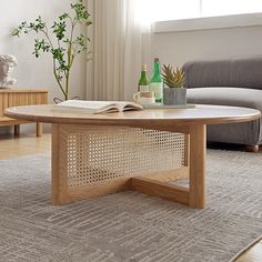 a coffee table with an open book on it