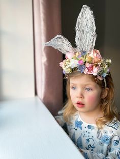 This handcrafted stunning artificial floral headband with lace bunny ears is the perfect accessory for your little ones for Easter celebrations and photo opportunities. Fully artificial and on a thin headband this piece will last year after year and can fit heads from children to adult. Made to order, please allow 4 days for your order to be made! If needed faster please contact us to ‘fast track’ your order which will be available in 2 days for an additional £5.99. Handmade using the finest sil Easter Crown, Easter Photo Backdrop, Easter Bunny Ears Headband, Lace Bunny Ears, Easter Headbands, Alice Tea Party, Model School