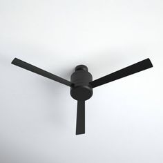 a black ceiling fan on a white wall