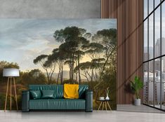 a living room with a painting on the wall and a couch in front of it