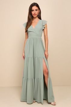 Charming Success Sage Brush Tiered Lace-Up Backless Maxi Dress Sage Green Floral Maxi Dress, Wedding Guest Dress Sage, Backyard Bridesmaid Dresses, Sage Bridesmaids Dress, Shoes With Sage Green Dress, Dusty Sage Dress, Halter Top Bridesmaid Dresses, Bridesmaid Dresses Sage Green, Seafoam Dress