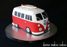 a red and white cake with a vw bus on top