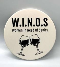 two wine glasses with the words winos written in black and white on them, against a gray background