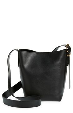 Madewell's newest leather bag collection is cool, modern and quietly luxe. With a magnetic closure and interior pocket, the mini bucket tote is perfectly sized to hold your phone, wallet, keys and more—plus, it has a shoulder strap and adjustable crossbody strap. It's so good, it's essential. Structured silhouette with flat base for stability Leather Imported Bucket Tote, Mini Bucket, Bag Collection, Black Leather Purse, Essential Bag, Leather Hobo Bag, Phone Wallet, Leather Hobo, Printed Bags