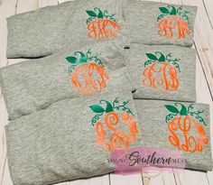 four monogrammed shirts with orange and green pumpkins on them