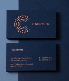 two black business cards with gold foil on them and the words caprock written in copper