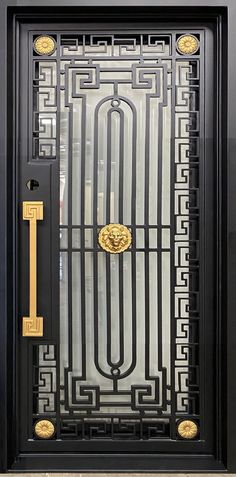 a black and gold door with an ornate design