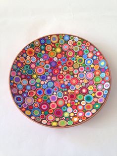 a colorful plate with circles painted on it