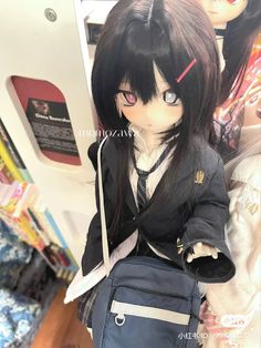 a doll with long black hair and blue eyes