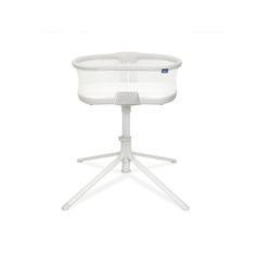 a white baby crib sitting on top of a tripod