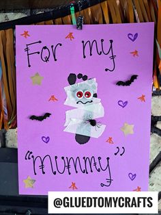 a purple sign that says for my mummy on it with bats and stars in the background