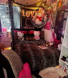 a bedroom decorated in leopard print with teddy bears on the bed and lights strung above