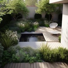 a small pond surrounded by trees and plants in a garden area with wooden decking