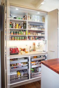 an organized pantry with lots of food in it