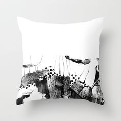 a black and white painting on a pillow