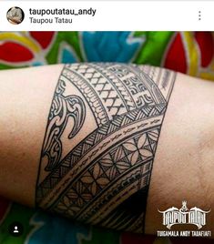 a person with a tattoo on their arm and the words tatobattau - andy