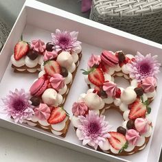 a box that has some kind of cake in it with flowers on the top and bottom