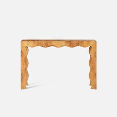 a wooden table that is made out of wood and has an intricate design on the top