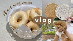 a woman holding a brown dog next to a basket of doughnuts and a bowl of donuts