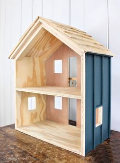 a doll house made out of plywood and wood