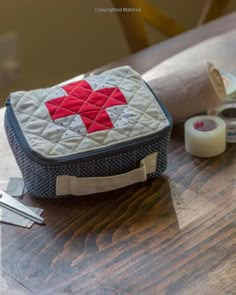 a sewing kit sitting on top of a wooden table