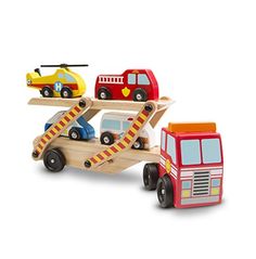 a wooden toy truck carrying cars on a ramp