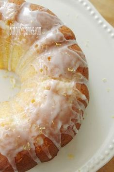 a bundt cake with icing on a white plate