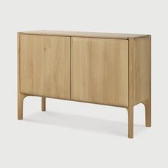 the sideboard is made out of wood and has two doors on each side, one with