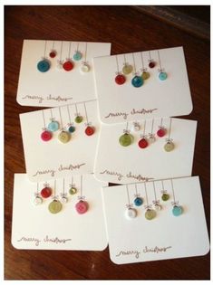 four christmas cards with buttons on them and the words diy christmas cards attached to them