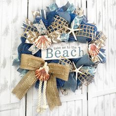 a beach wreath with seashells and starfish on it