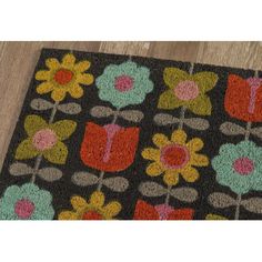 a black rug with colorful flowers on it