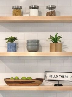 some shelves with bowls and plants on them