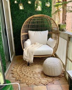 a wicker chair and ottoman on a balcony