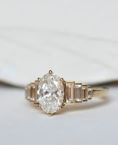 a diamond ring sitting on top of a table