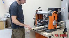 a man working on a machine in a shop