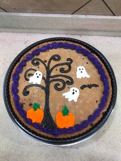 a decorated cake with halloween decorations on it