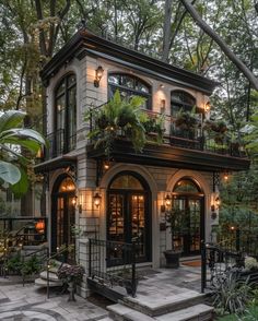 a small house with lots of windows and plants on the balconies