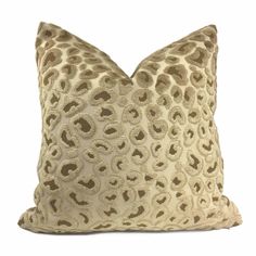 a leopard print pillow on a white background