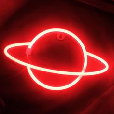 a red neon sign with an image of the planet saturn on it's side