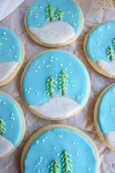 frosted cookies decorated with trees and snow