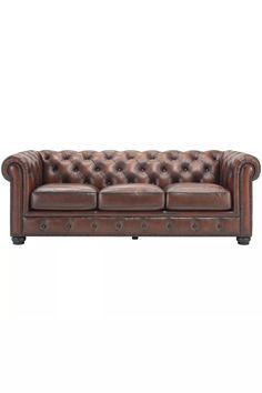 a brown leather couch with buttons on the back and arms, in front of a white background