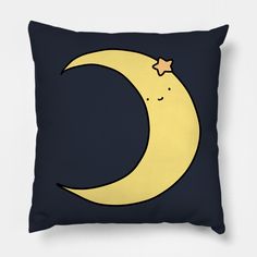 a pillow with a crescent moon and star on it's side, against a dark blue background