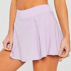 Purple Skort With Built-in Shorts, Sports Skirted Shorts, Sports Mini Skirt Pleated, Sports Pleated Mini Skirt, Solid Sports Skort With Lined Skirt, Solid Tennis Skirt With Lined Skirt For Workout, Solid Color Lined Tennis Skirt For Workout, Solid Color Tennis Skirt With Lined Skirt For Workout, Solid Skirted Tennis Skort