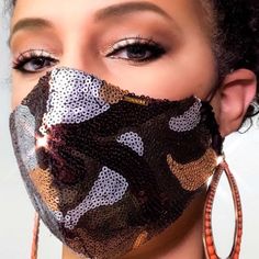 Being safe has never looked so good.  Slow the spread with a fabric while staying stylish in a camouflage sequin face mask by Braazi. Our face masks are true designer quality.  This luxury bling face mask is hand-made in our Maryland studio with meticulous attention to every detail.  Each mask in our designer collection looks elegant and luxurious while also being breathable, lightweight and comfortable enough for all-day wear. LIMITED EDITION! We have a very limited amount of the beautiful, sof Luxury Face Mask, Mask Types, Large Sequins, Mask Fashion, Face Mask Fashion, Mouth Mask, Dust Mask, Fashion Face Mask, Ear Loop