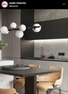 an image of a modern kitchen setting with marble countertops and black cabinets, along with wooden chairs