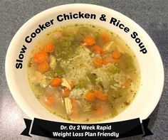 a bowl of chicken and rice soup with the words slow cooker chicken & rice soup