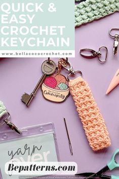 there is a crochet keychain on the table with scissors and other items