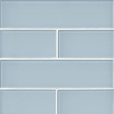 a close up view of a white subway tile wall with no grouting on it